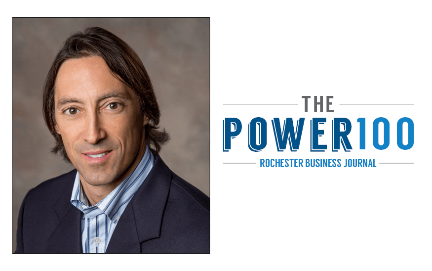 Picture of DiMarco Group President, John DiMarco, with the RBJ Power 100 Logo